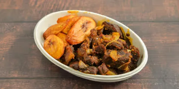 Spicy asun peppered goat meat with plantain from OddySamm's Winnipeg
