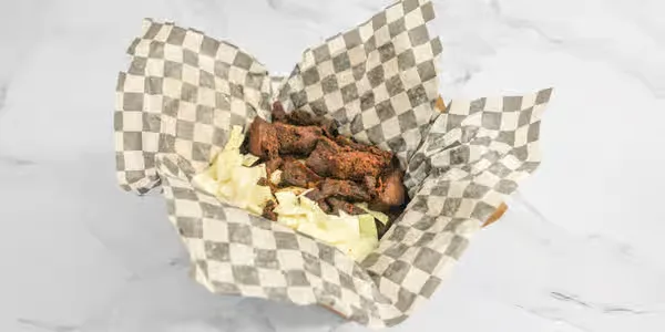 Grilled beef suya coated in yaji spice, Nigerian street food in Winnipeg