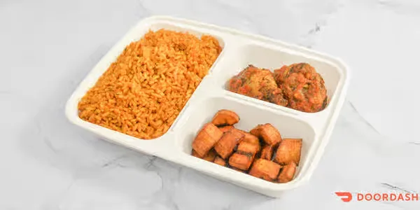 Jollof rice with fried plantain and peppered chicken in Winnipeg