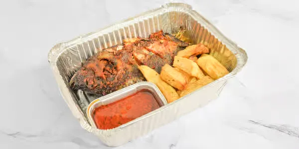 Crispy fried tilapia with potatoes and Nigerian pepper sauce in Winnipeg