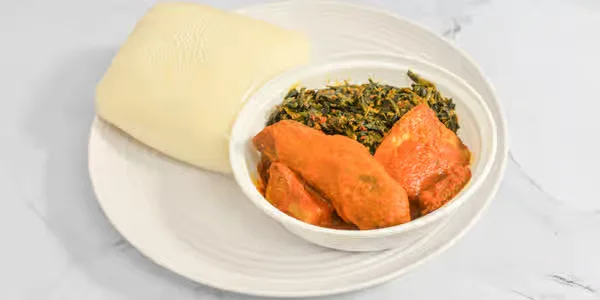 Pounded yam served with rich Nigerian soup in Winnipeg