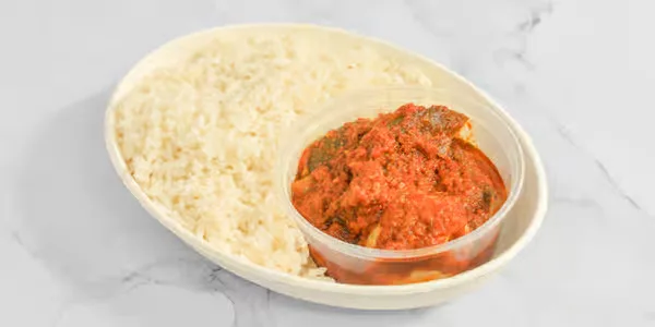 Steamed white rice with Nigerian pepper stew in Winnipeg